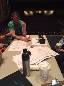 Josh Williams collaborates with his production team at the Bisgrove Theater at Cayuga Community College.
